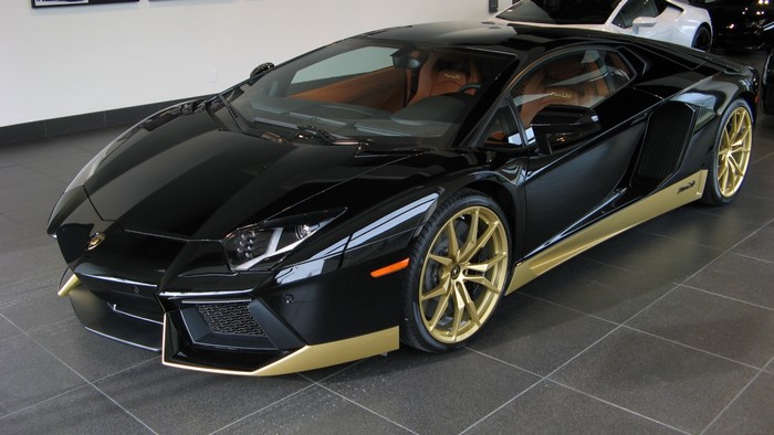 Black Lamborghini Aventador with gold accents