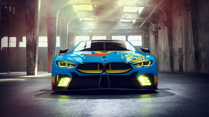 BMW M8 GTE race car in a warehouse