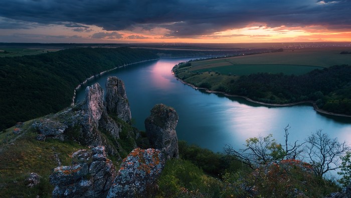 River valley at sunset with rocky cliffs