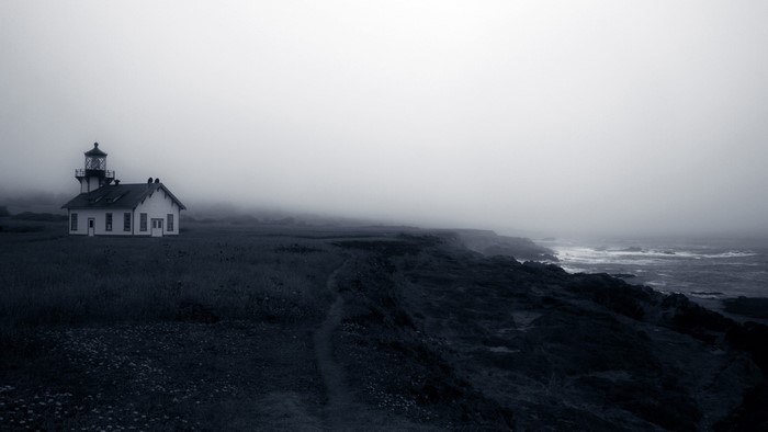 Lighthouse on a foggy coast