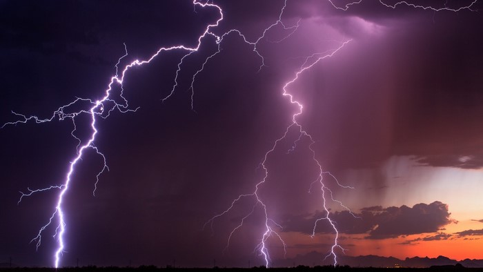 Lightning strikes during a storm over a landscape