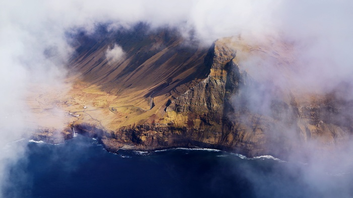 Faroe Islands cliffs shrouded in clouds, 4K