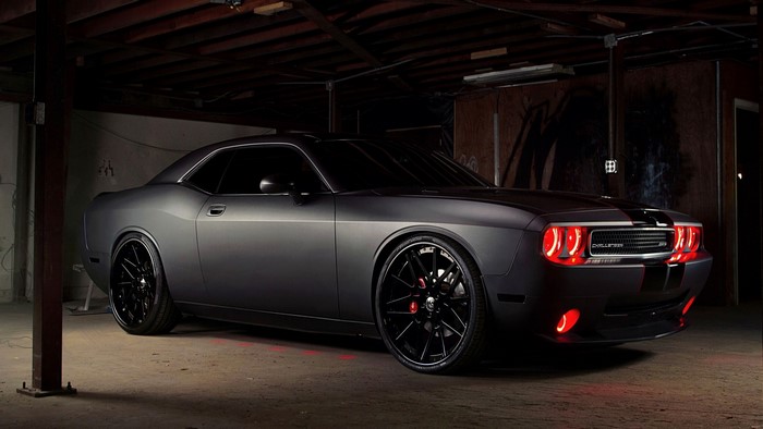 Matte black Dodge Challenger with red accents
