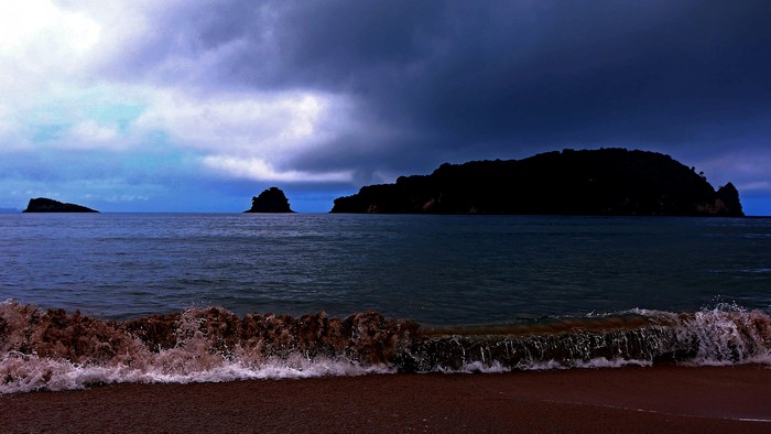 4K Ocean Islands Under Dark Clouds