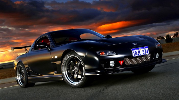 Black Mazda RX-7 with racing spoiler