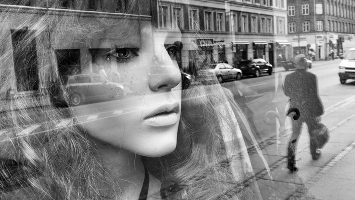 Double exposure of mannequin and street scene
