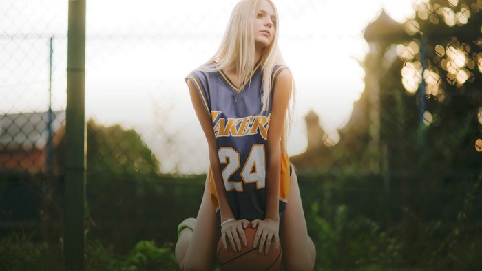 Girl in Kobe Bryant Lakers Jersey with Basketball