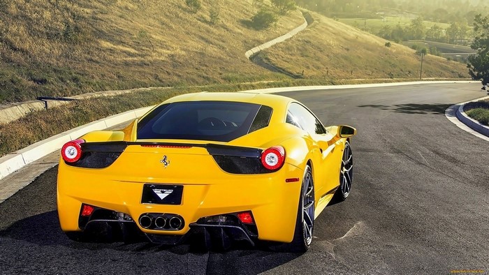 Yellow Ferrari 458 Italia on a Winding Road