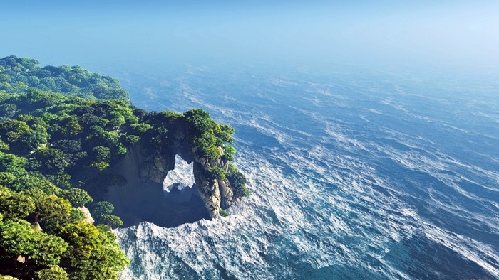 Island cliff with archway overlooking the ocean