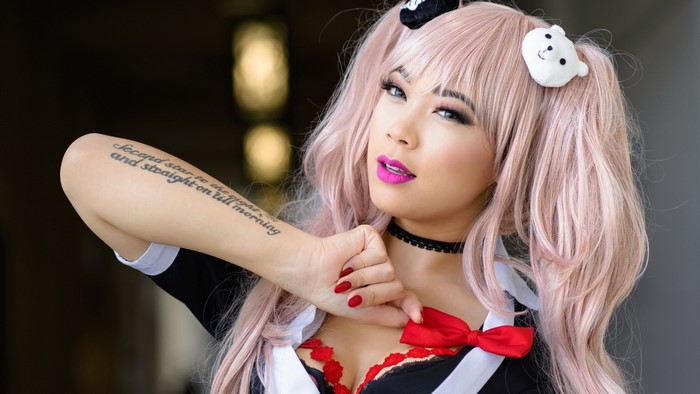 Girl with pink pigtails and a tattoo