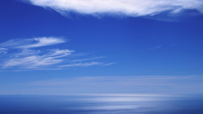 Blue Sky and Ocean with Wispy Clouds