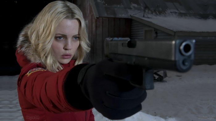Woman with gun in snow