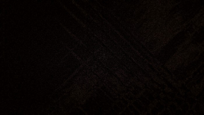 Dark textured background with subtle lines