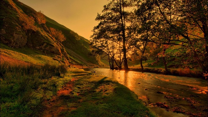 River flowing through a valley at sunset