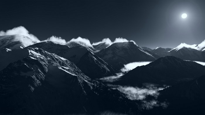 Moonlit mountain range with clouds