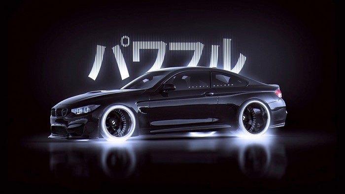 Black BMW M4 Coupe with glowing wheels