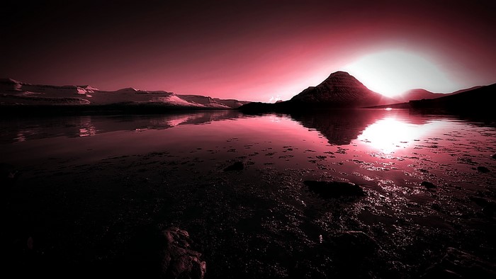Sunset over a lake with mountains