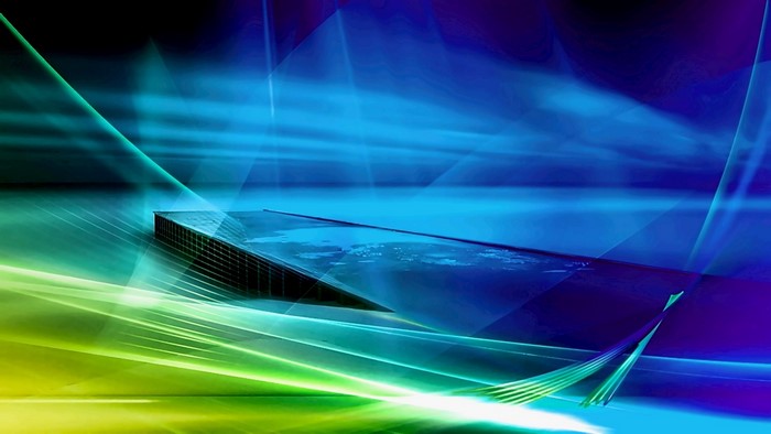 Abstract blue and green light streaks over a platform