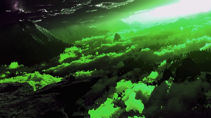 Green clouds over mountains and forest