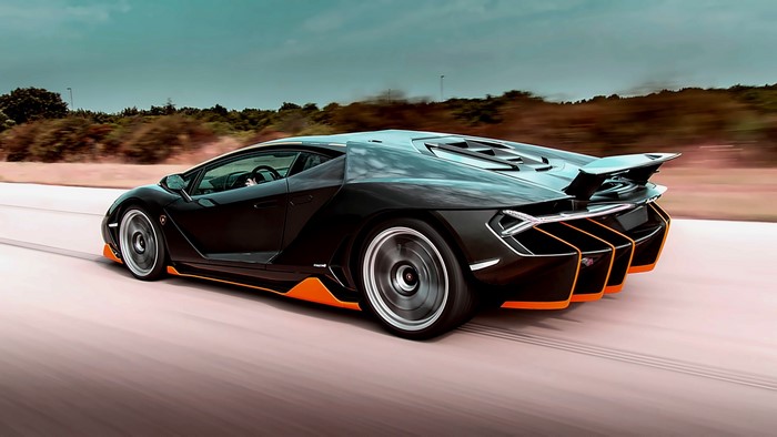 Lamborghini Centenario driving on a road