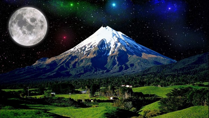 Snow-capped mountain under a starry sky with moon