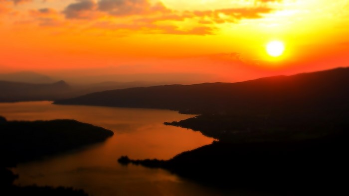 Sunset over a lake and mountains