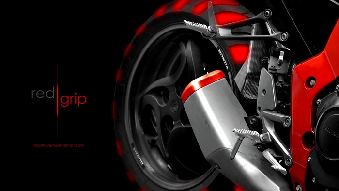 Red Grip Honda Motorcycle Exhaust and Wheel