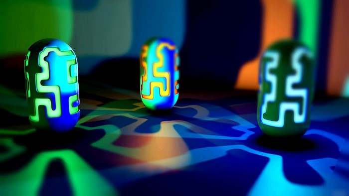 Three glowing alien pods on a patterned surface