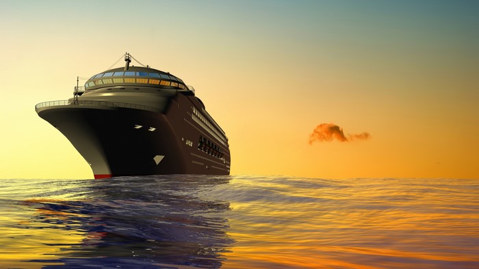 4K cruise ship on the ocean at sunset