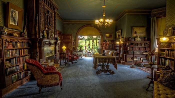 Old room filled with books and antique furniture