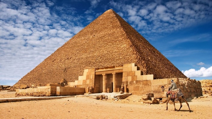 The Great Pyramid of Giza with a man on a camel