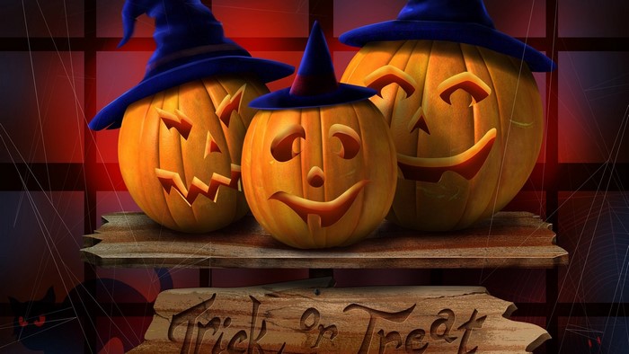 Three Jack-o'-lanterns with witch hats and a Trick or Treat sign