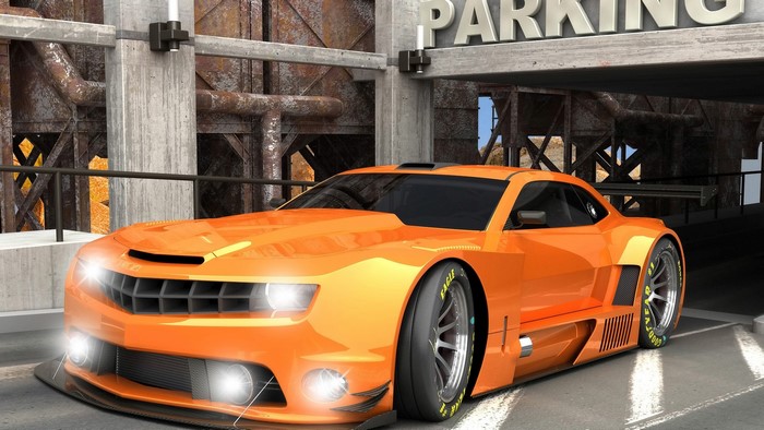 Orange Camaro race car in parking garage