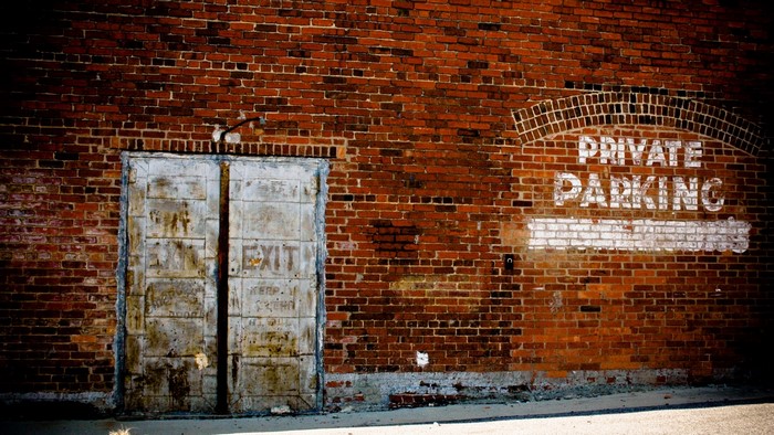 Private Parking Brick Wall with Exit Door