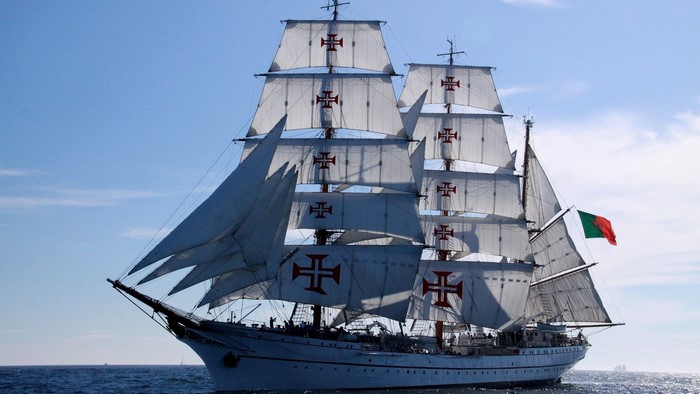 Tall sailing ship with Portuguese flags