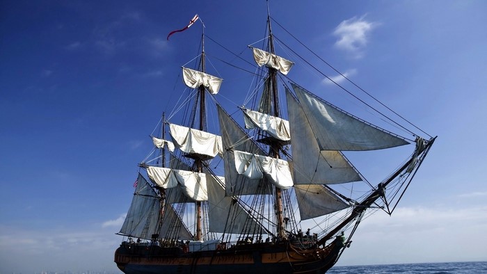 Tall Ship Sailing on a Blue Sky