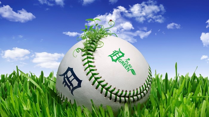 Detroit Tigers baseball with green growth and ladybug