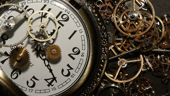 Close-up of a pocket watch with visible gears
