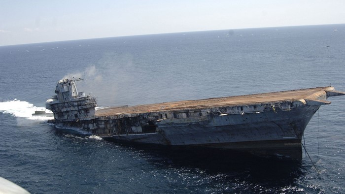 Sinking aircraft carrier in the ocean