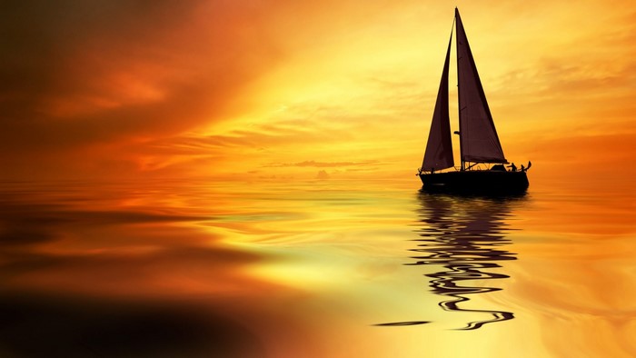 Sailboat on the sea at sunset