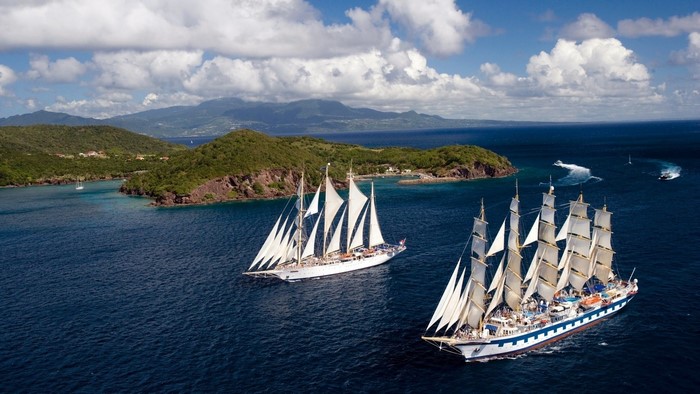 Sailing Ships on the Ocean Near Islands