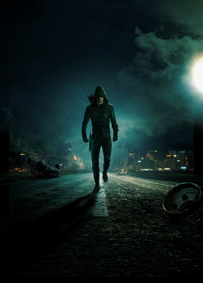 Green Arrow in a destroyed city at night
