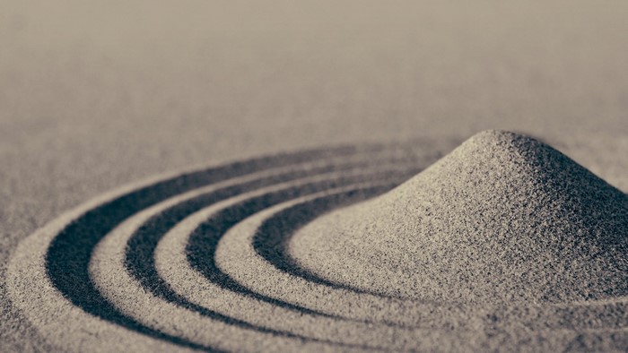 Sand garden with raked patterns