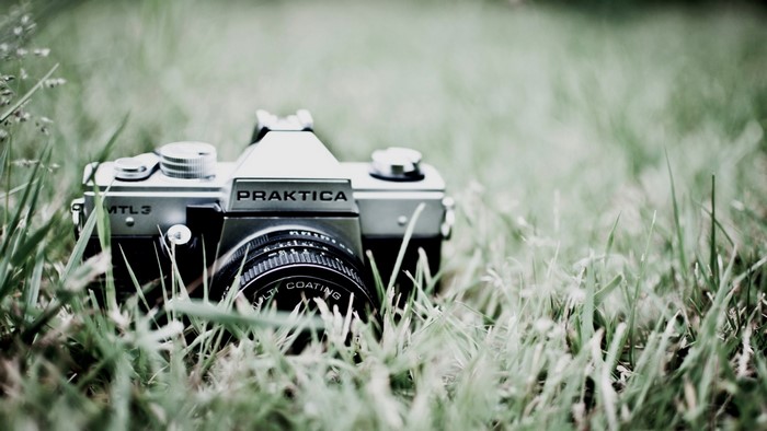 Old Praktica MTL 3 camera in grass