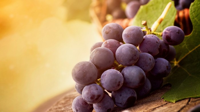 Purple Grapes on a Wooden Surface