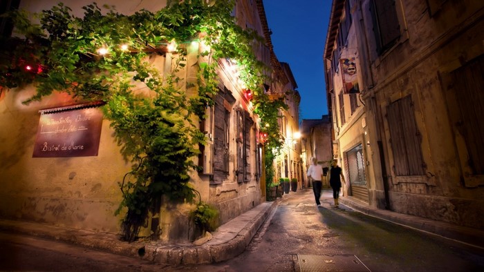 Street at night with people walking