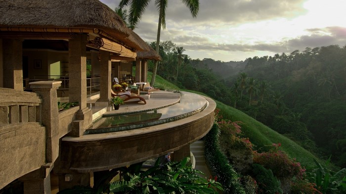 Luxury hotel balcony overlooking a tropical jungle valley