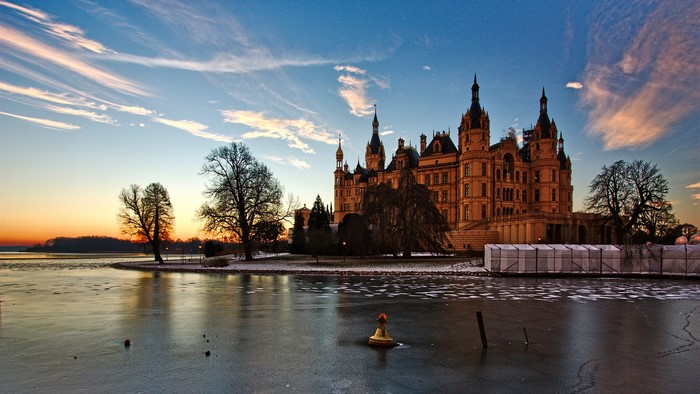 Schwerin Castle at sunset with frozen lake
