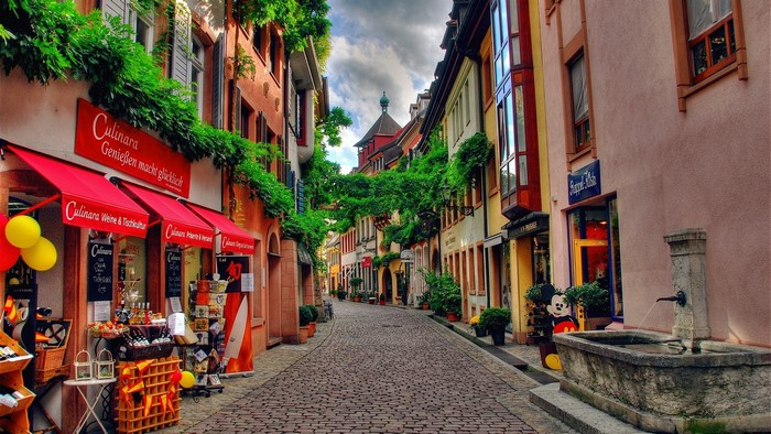 German street with shops and fountain
