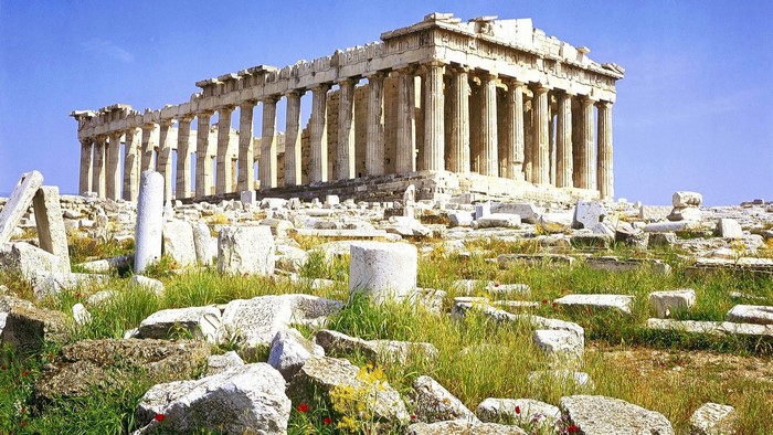 The Parthenon ruins under a blue sky